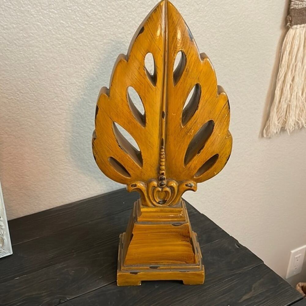 carved faux-wood monstera leaf sculpture